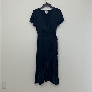 Blue Rain Navy blue satin crepe true wrap dress with ruffles. Medium